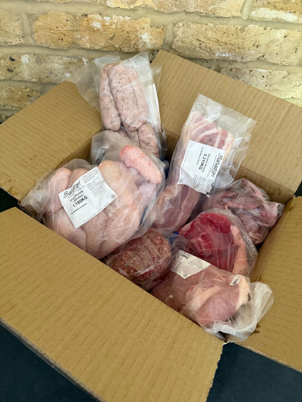 Father's Day Grill Master's Box with sirloin steaks burgers sausages pork steaks chicken wings bacon and spatchcock chicken