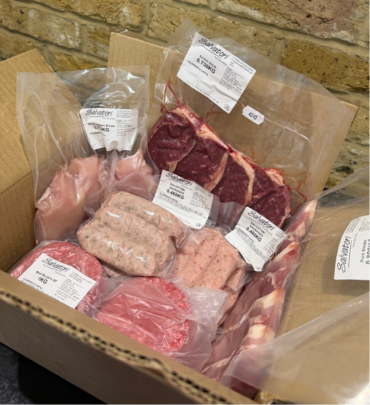 Family BBQ meat box with sirloin steaks burgers sausages chicken breasts and pork steaks