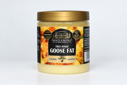 A jar of Hazlemere Free Range Goose Fat against a plain white background. The product is in a clear plastic jar showing the pale yellow goose fat inside, topped with a metallic gold lid and featuring a black and gold label.